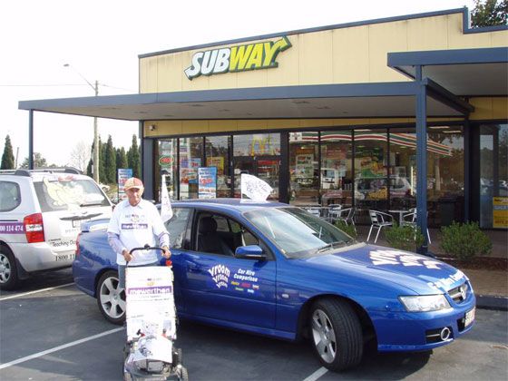 vroomvroomvroom car hire parked in front of subway